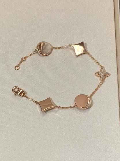 Mysitc STAR AND SUN 5 MOTIF MOP PINK GOLD BRACELET